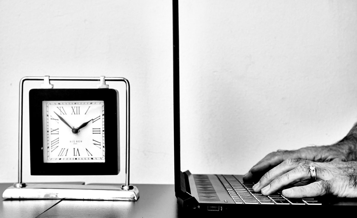 Person working on laptop in a balanced, peaceful environment representing work-life balance